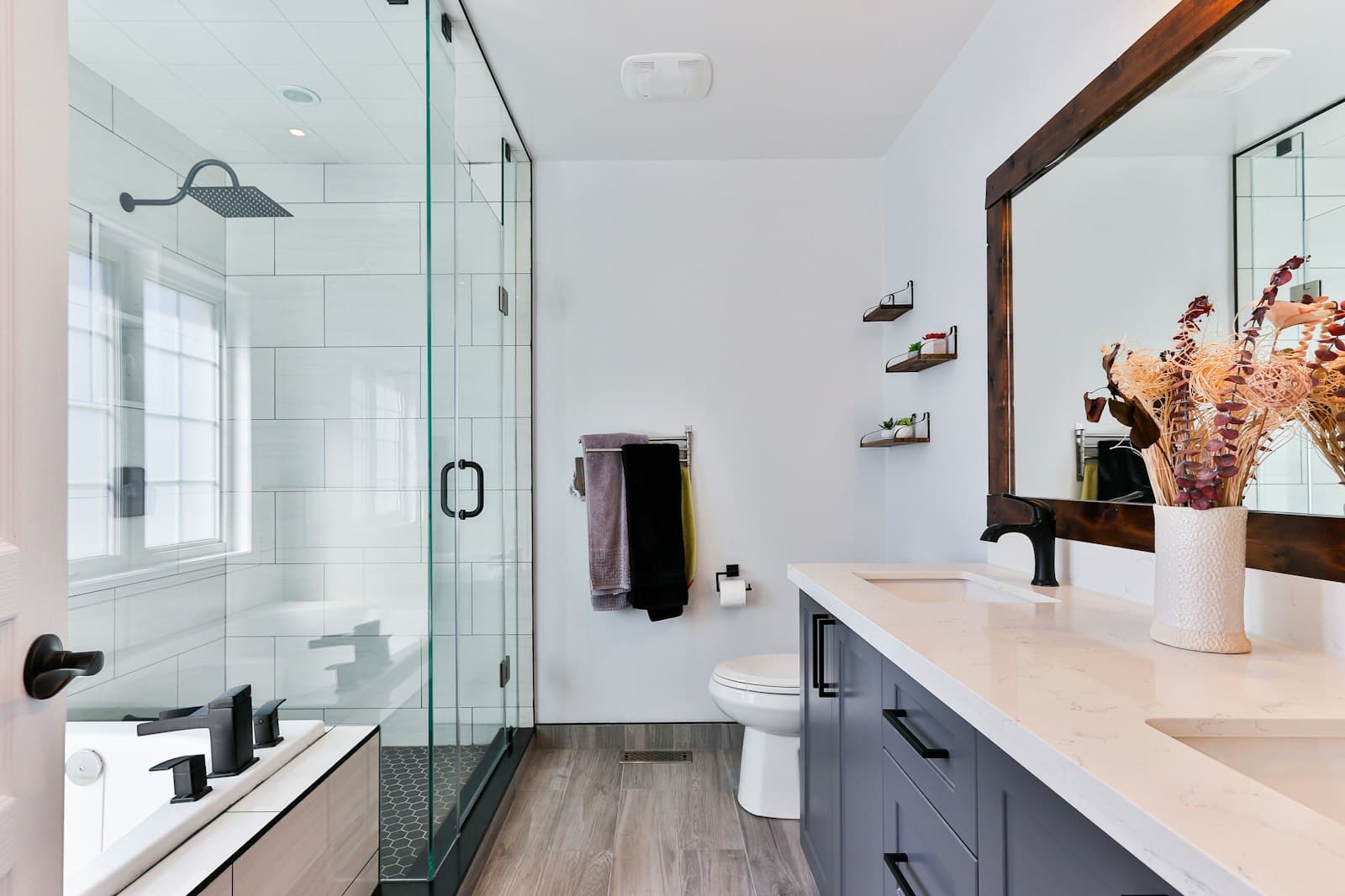 Spotless modern bathroom with glass shower and vanity