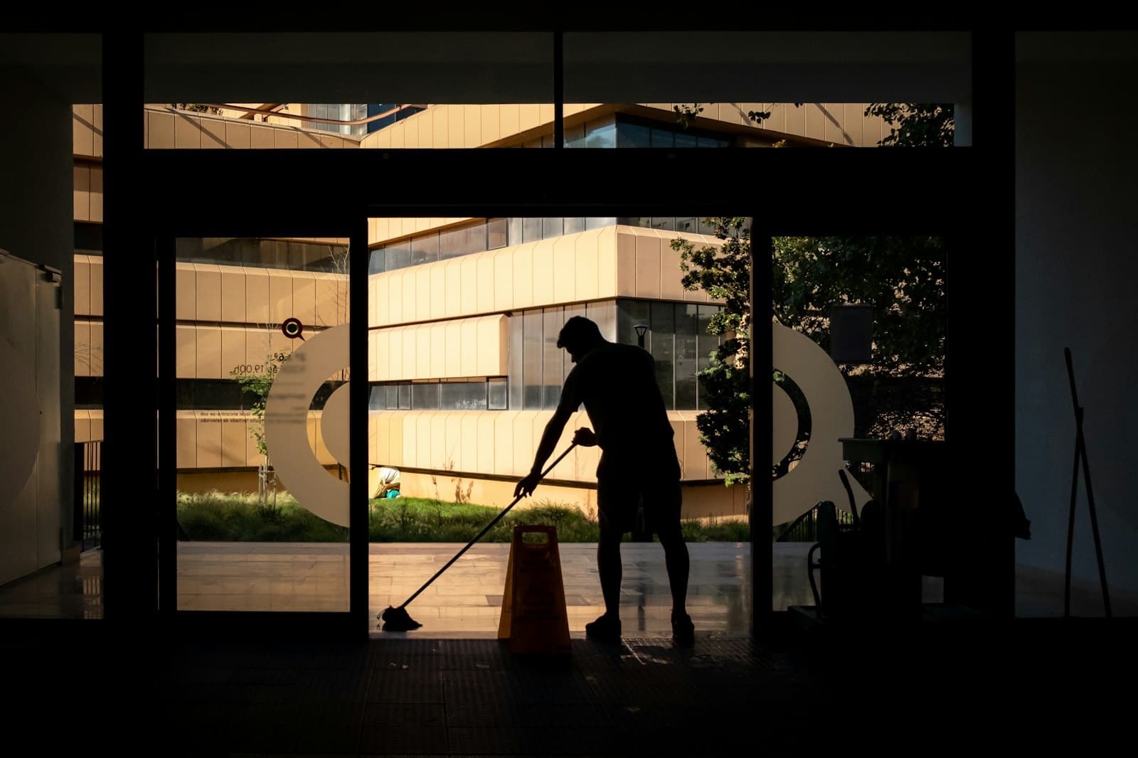 Cleaner mopping the floor of a commercial building